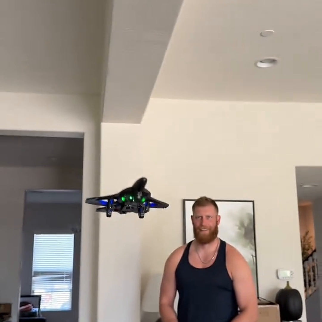 Creator frame: a bearded man in a black tank top stands in a hallway as the jet hovers beside him, a dog nearby.