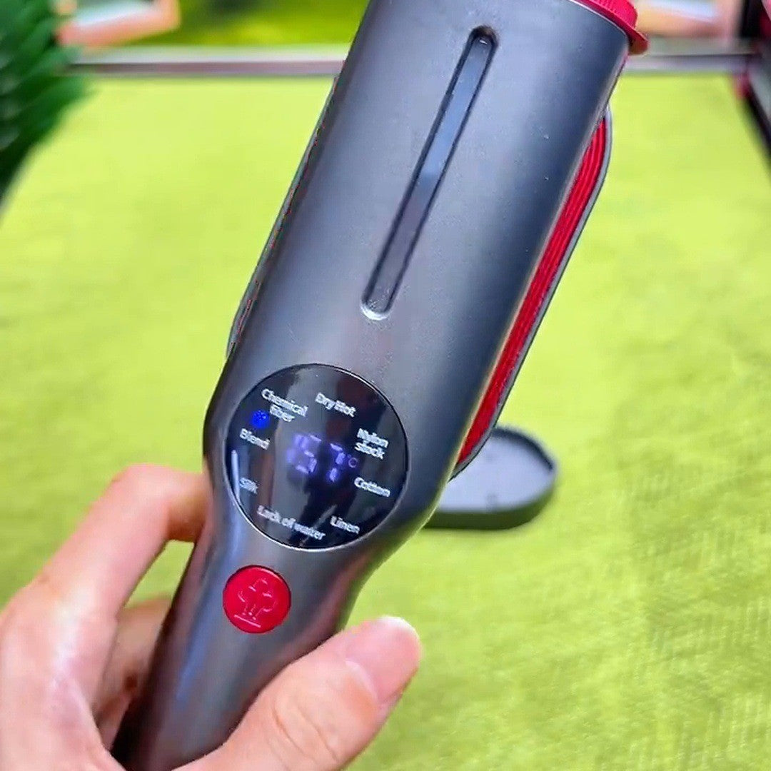 Hand holding the steamer, lit display facing camera