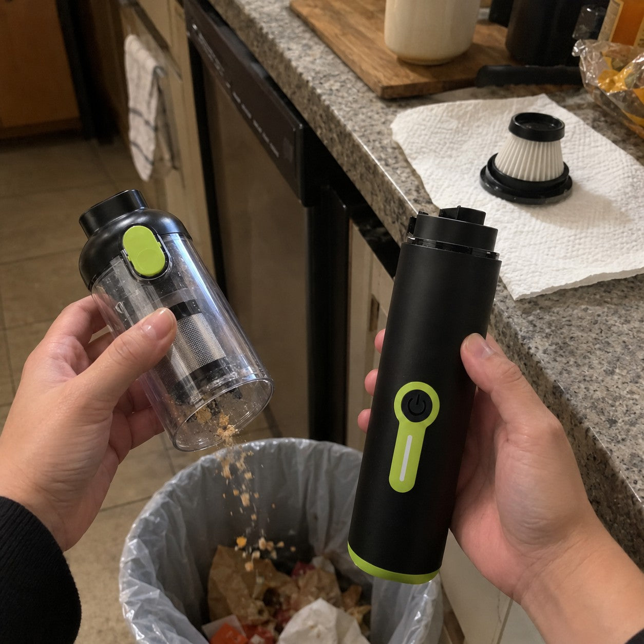 Hands separate the clear dust cup from the motor body and tip crumbs over a bin