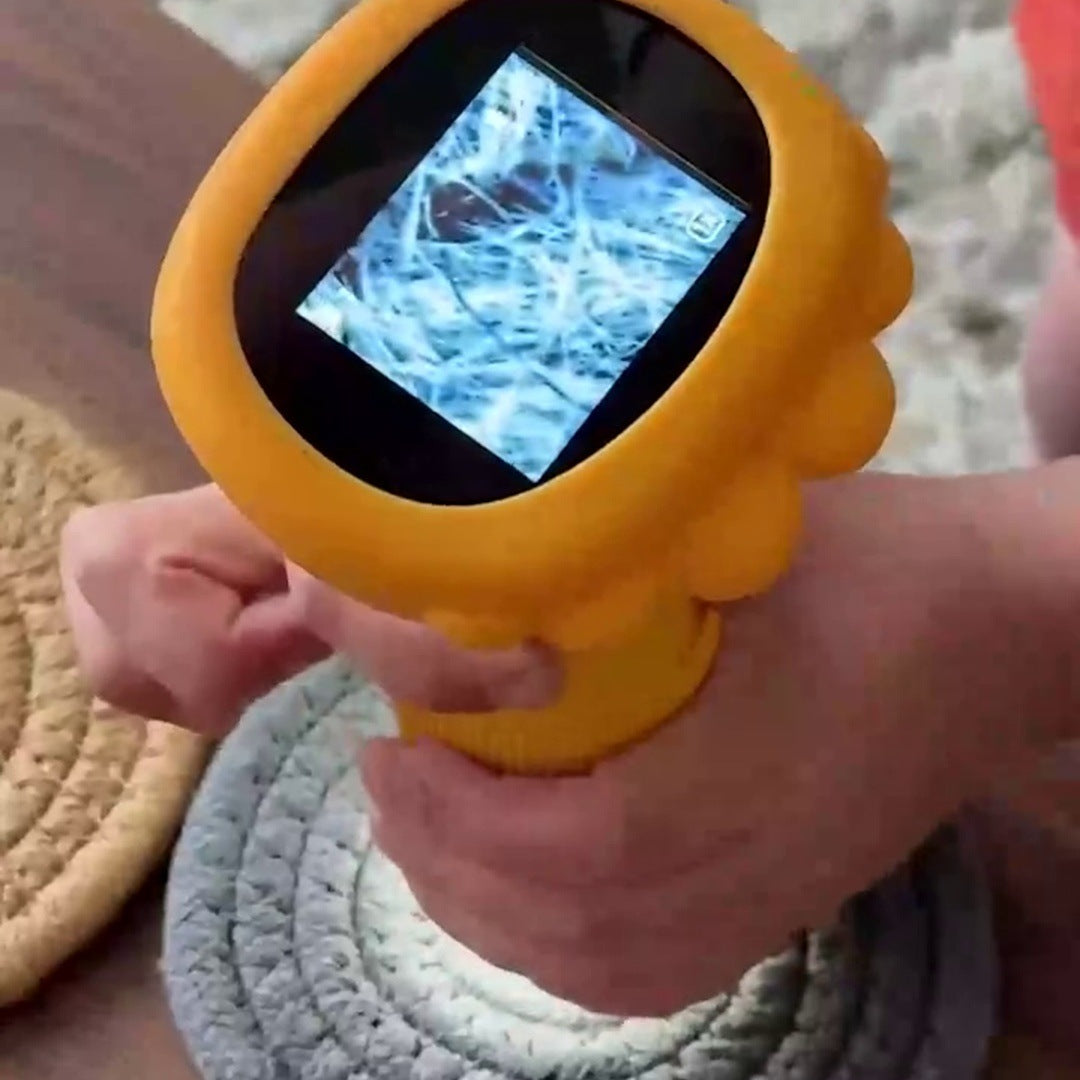 Real child hands holding yellow scope