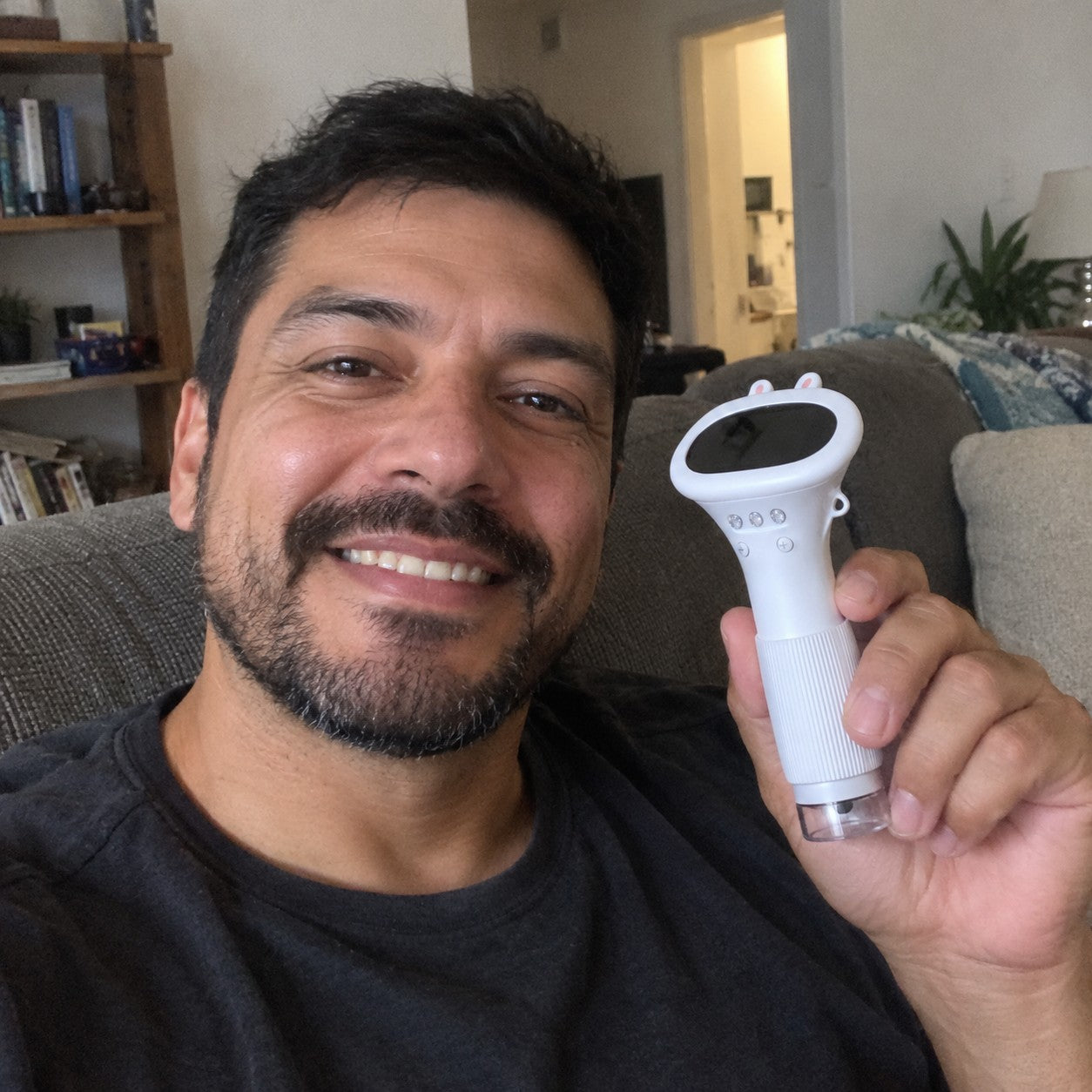 Marco R in a home selfie holds the white bunny scope